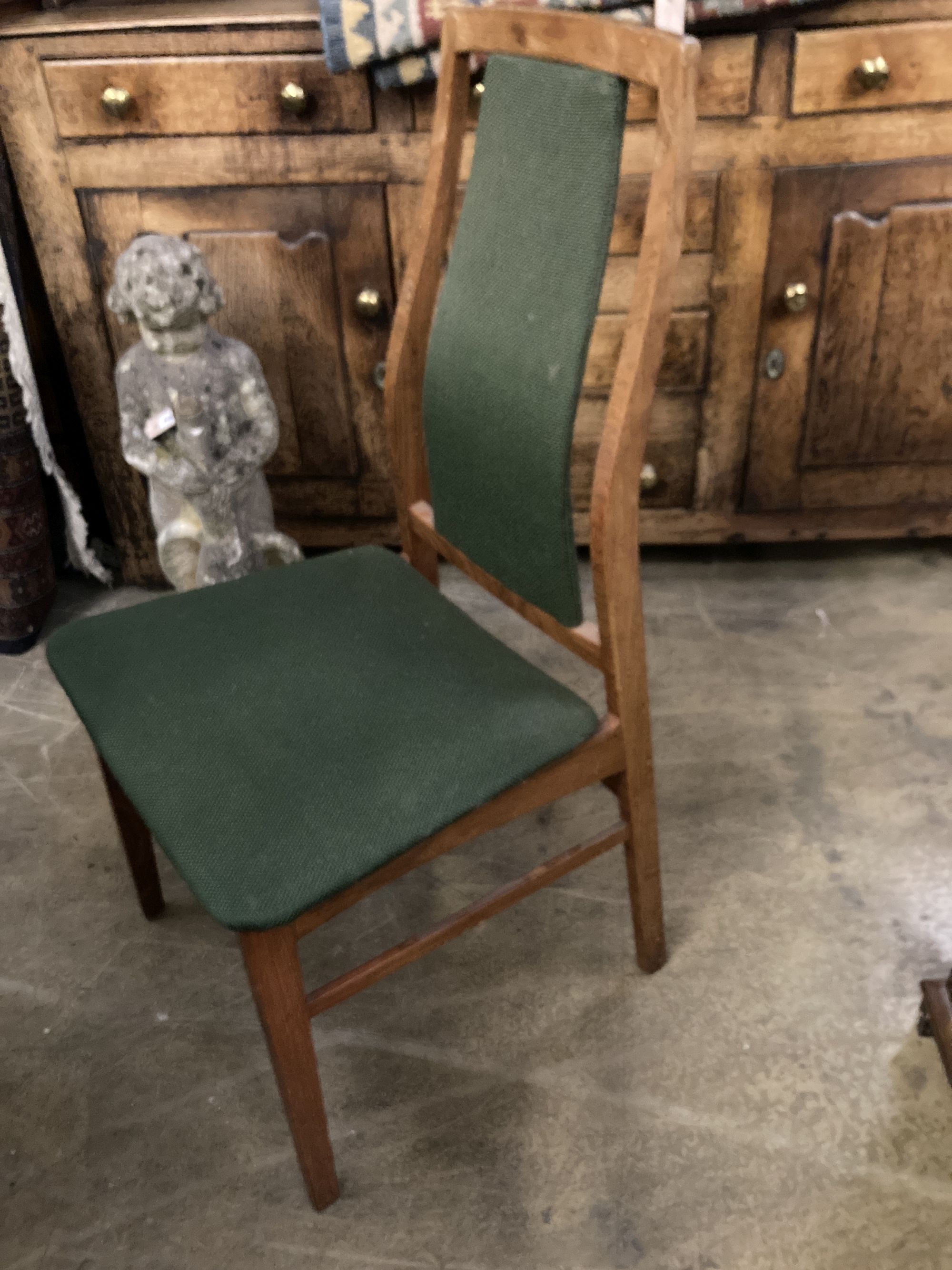 A set of eight mid century design Danish teak high back dining chairs